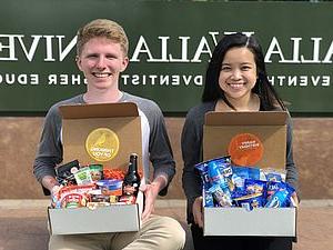 Students holding surprise boxes