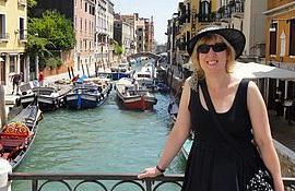 Cynthia in Italy on a bridge over a canal